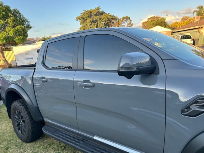 Grey Ford Ranger Raptor with premium dark window tint – enhanced heat rejection, glare reduction, and sleek look.