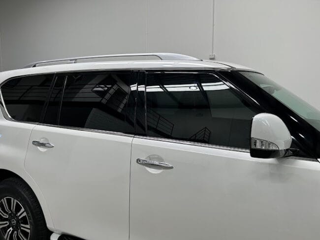 White SUV with high-performance window tint – improved cabin comfort, UV protection, and modern aesthetic.